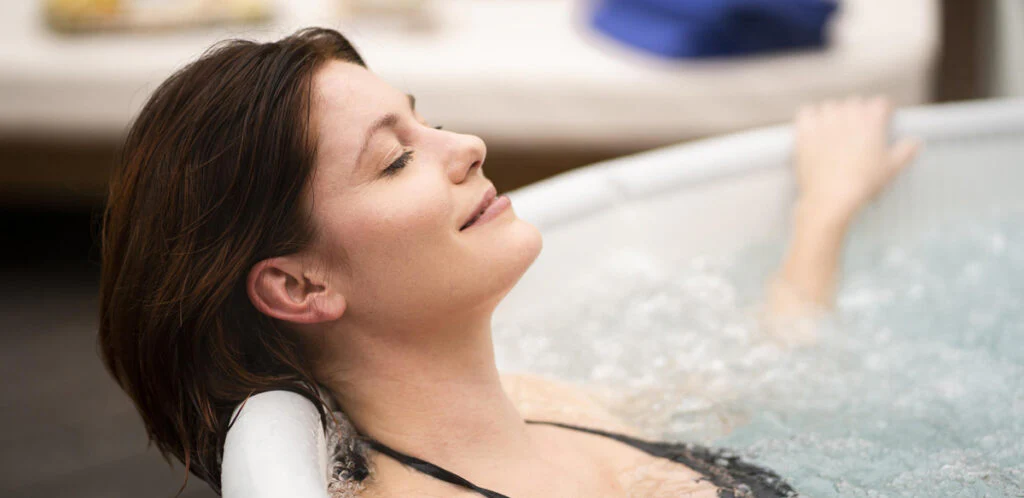 Luxury heated jacuzzi spa experience for couples in Denpasar villa with professional massage Denpasar therapist service and traditional Balinese healing atmosphere